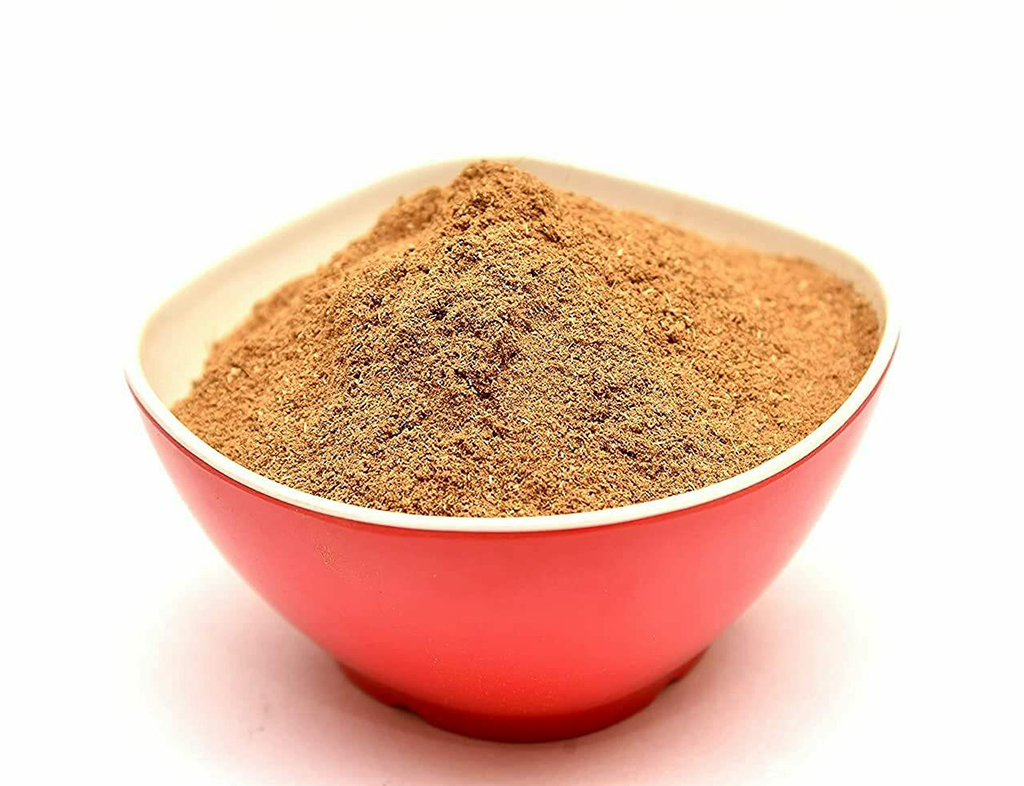 bowl of dried beet root powder isolated on white background